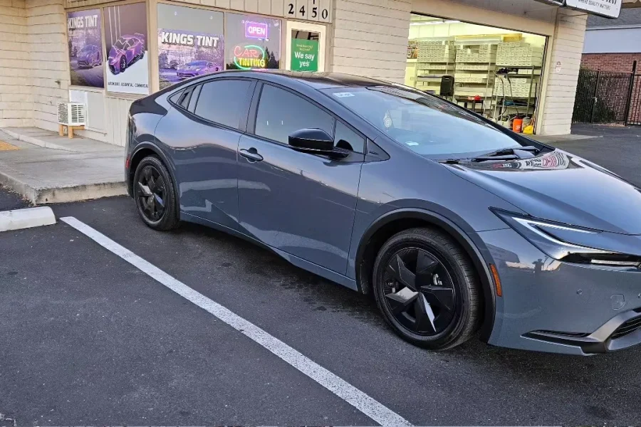Gray 2023 Toyota Prius with freshly tinted windows, parked in front of King Auto Tint at 2450 Fulton Ave, Sacramento