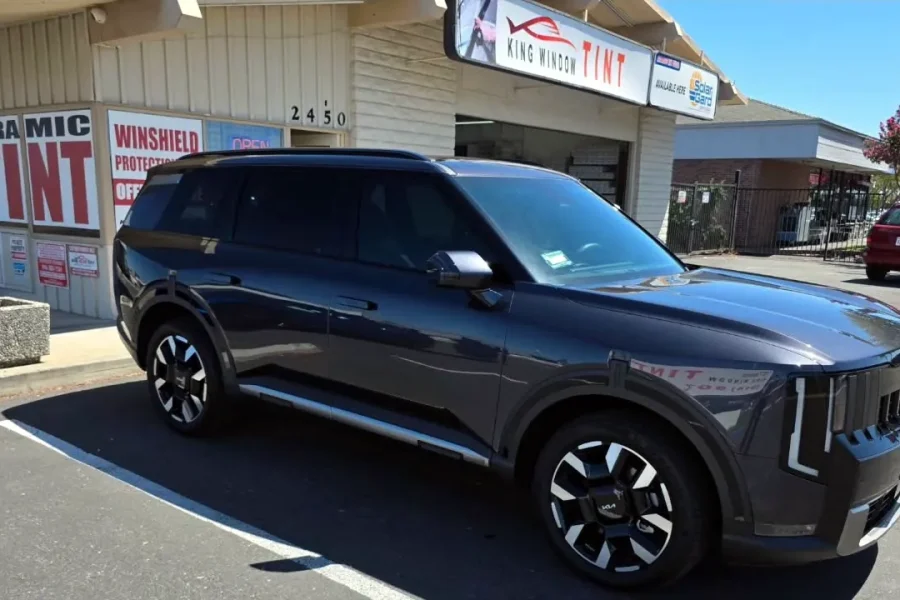 Dark gray 2026 Kia Telluride with freshly tinted windows, parked in front of King Window Tint at 2450 Fulton Ave, Sacramento