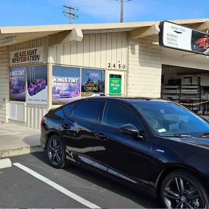 Black Acura Integra with freshly tinted windows, outside the King Auto Tint shop on Fulton Ave in Sacramento
