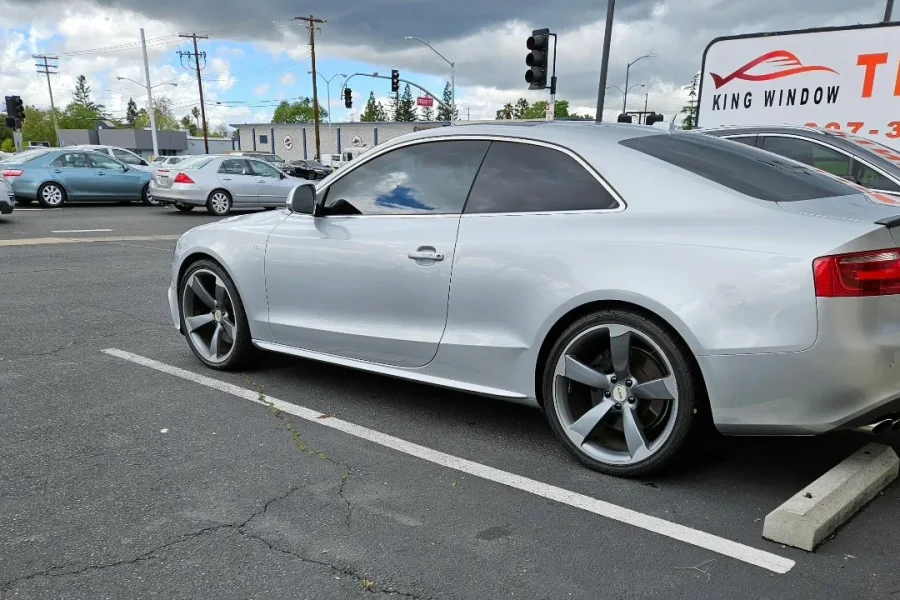 Silver Audi A5 with freshly tinted windows, in the King Window Tint parking lot on Fulton Avenue, Sacramento