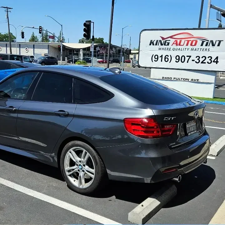 Gray BMW 3 Series Gran Turismo with freshly tinted windows, photographed after its tint job at King Auto Tint in Sacramento