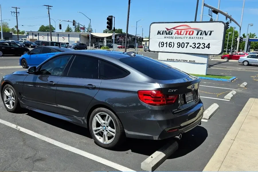 Gray BMW 3 Series Gran Turismo with freshly tinted windows, photographed after its tint job at King Auto Tint in Sacramento