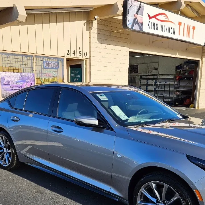 Silver Cadillac CT5 with freshly tinted windows, outside the King Window Tint shop on Fulton Ave in Sacramento