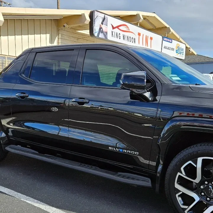 Black Chevrolet Silverado EV with freshly tinted windows, photographed after its tint job at King Window Tint in Sacramento