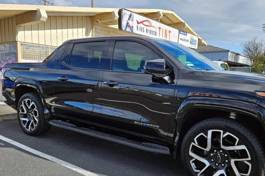 Black Chevrolet Silverado EV with freshly tinted windows, photographed after its tint job at King Window Tint in Sacramento