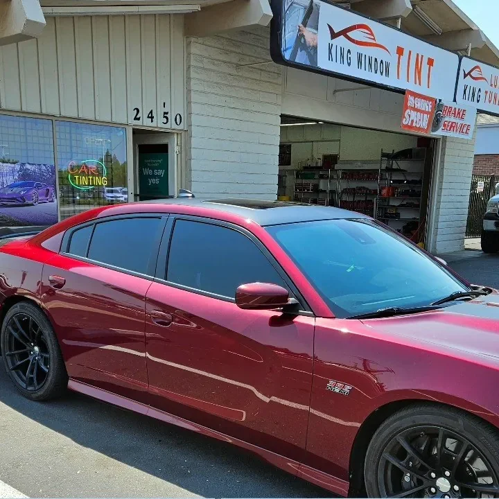 Burgundy Dodge Charger Scat Pack with freshly tinted windows, photographed after its tint job at King Window Tint in Sacramento