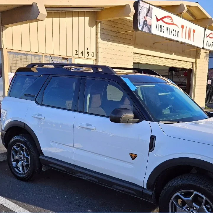 White Ford Bronco Sport with freshly tinted windows, parked in front of King Window Tint at 2450 Fulton Ave, Sacramento
