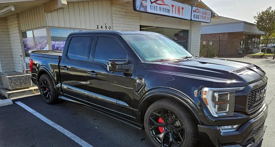 Black Ford F-150 Shelby with freshly tinted windows, parked in front of King Window Tint at 2450 Fulton Ave, Sacramento