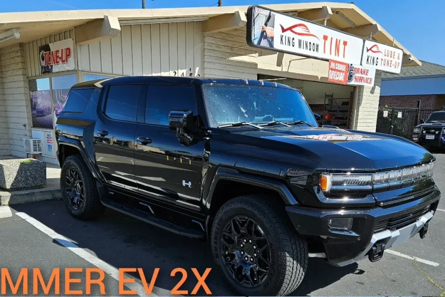 Black GMC Hummer EV SUV with freshly tinted windows, outside the King Window Tint shop on Fulton Ave in Sacramento