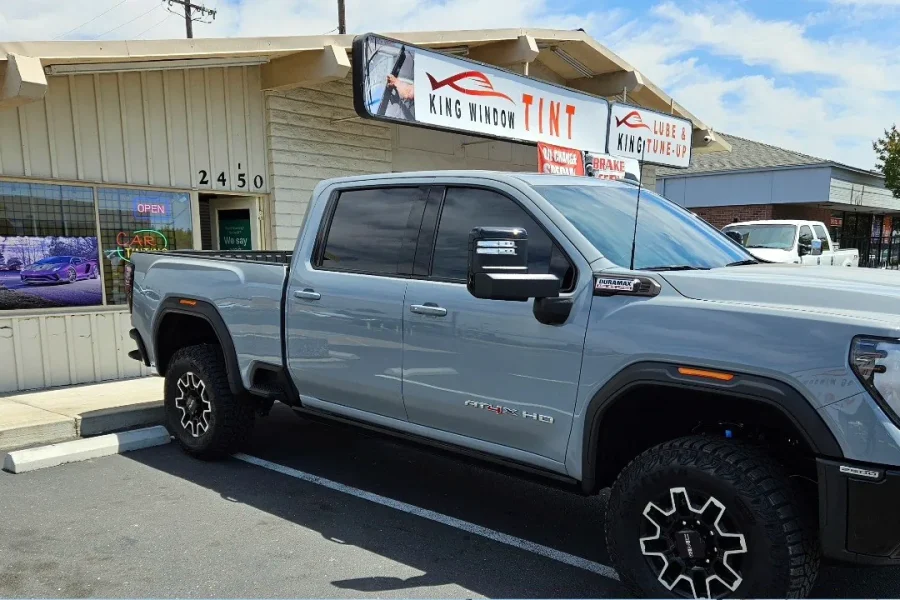 Gray GMC Sierra 2500HD AT4X with freshly tinted windows, photographed after its tint job at King Window Tint in Sacramento