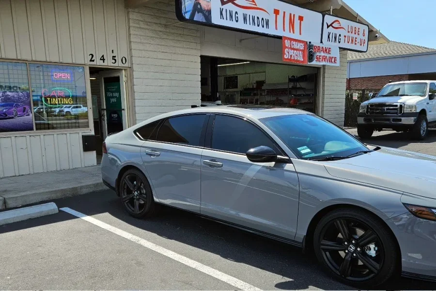 Light gray Honda Accord with freshly tinted windows, parked in front of King Window Tint at 2450 Fulton Ave, Sacramento