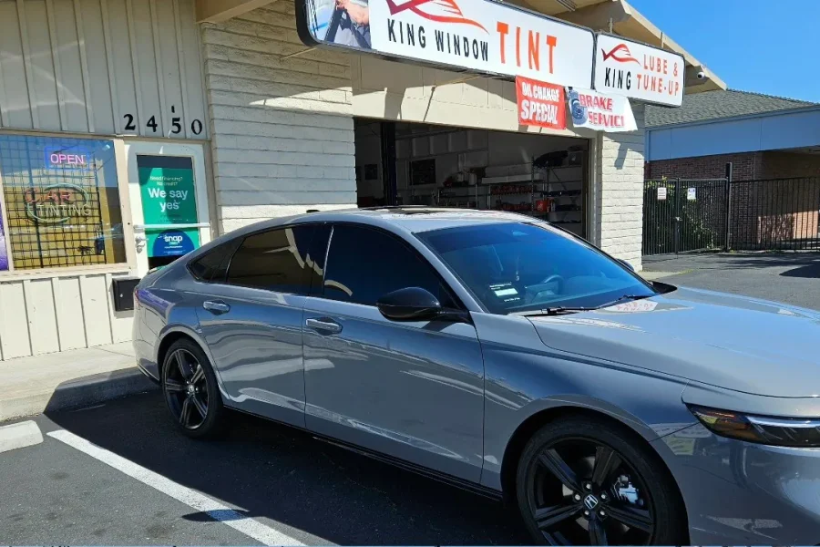 Gray Honda Accord with freshly tinted windows, outside the King Window Tint shop on Fulton Ave in Sacramento