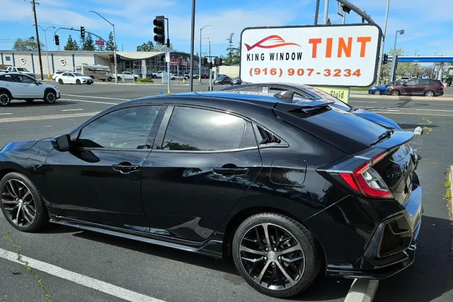 Black Honda Civic with freshly tinted windows, photographed after its tint job at King Window Tint in Sacramento, view 2