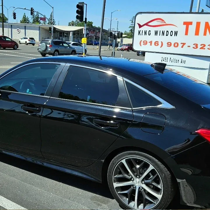 Black Honda Civic with freshly tinted windows, photographed after its tint job at King Window Tint in Sacramento