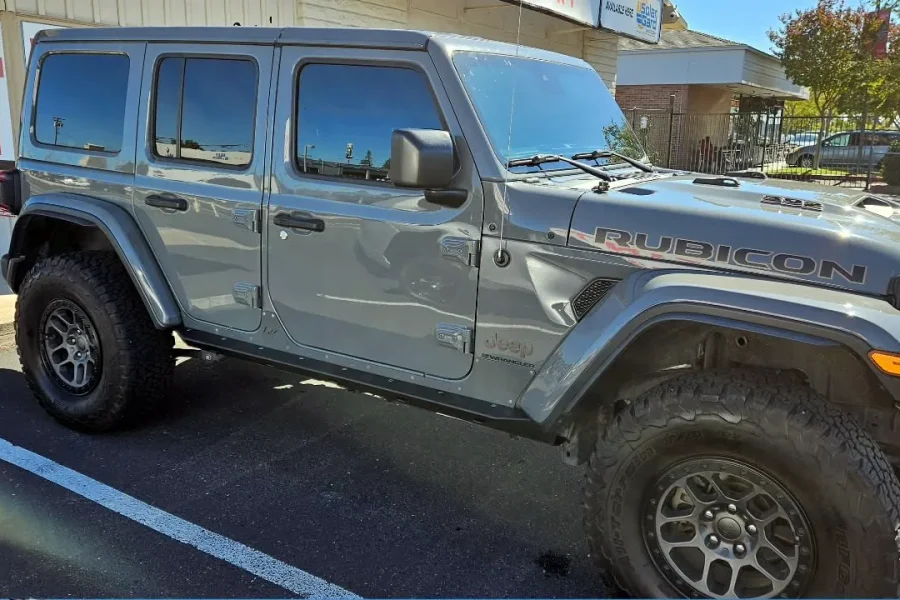 Gray Jeep Wrangler Rubicon with freshly tinted windows, photographed after its tint job at King Window Tint in Sacramento