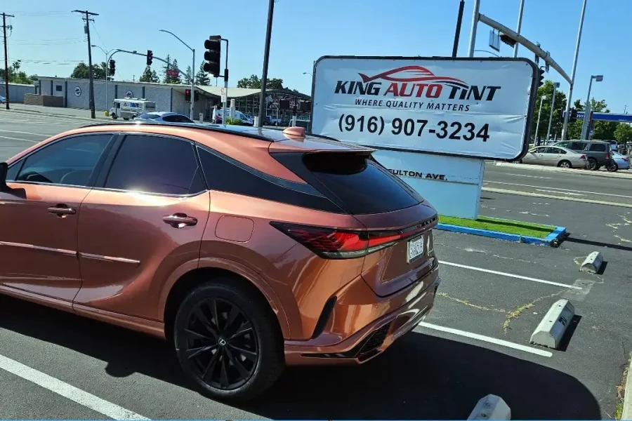 Copper Lexus RX with freshly tinted windows, photographed after its tint job at King Auto Tint in Sacramento