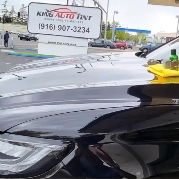Black Lincoln Continental after a ceramic coating, parked in front of King Auto Tint at 2450 Fulton Ave, Sacramento