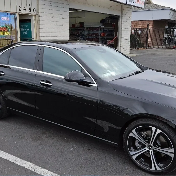 Black Mercedes-Benz C-Class with freshly tinted windows, in the King Window Tint parking lot on Fulton Avenue, Sacramento