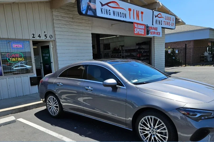 Gray Mercedes-Benz CLA with freshly tinted windows, outside the King Window Tint shop on Fulton Ave in Sacramento