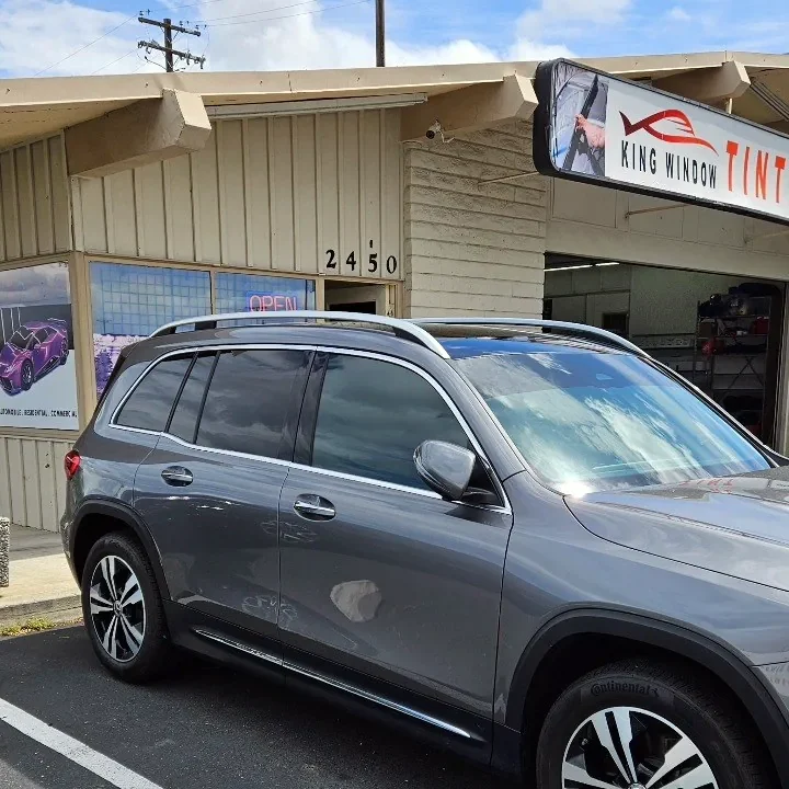 Gray Mercedes-Benz GLB with freshly tinted windows, outside the King Window Tint shop on Fulton Ave in Sacramento