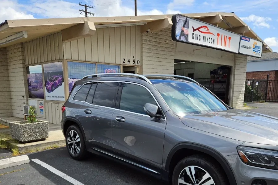 Gray Mercedes-Benz GLB with freshly tinted windows, outside the King Window Tint shop on Fulton Ave in Sacramento