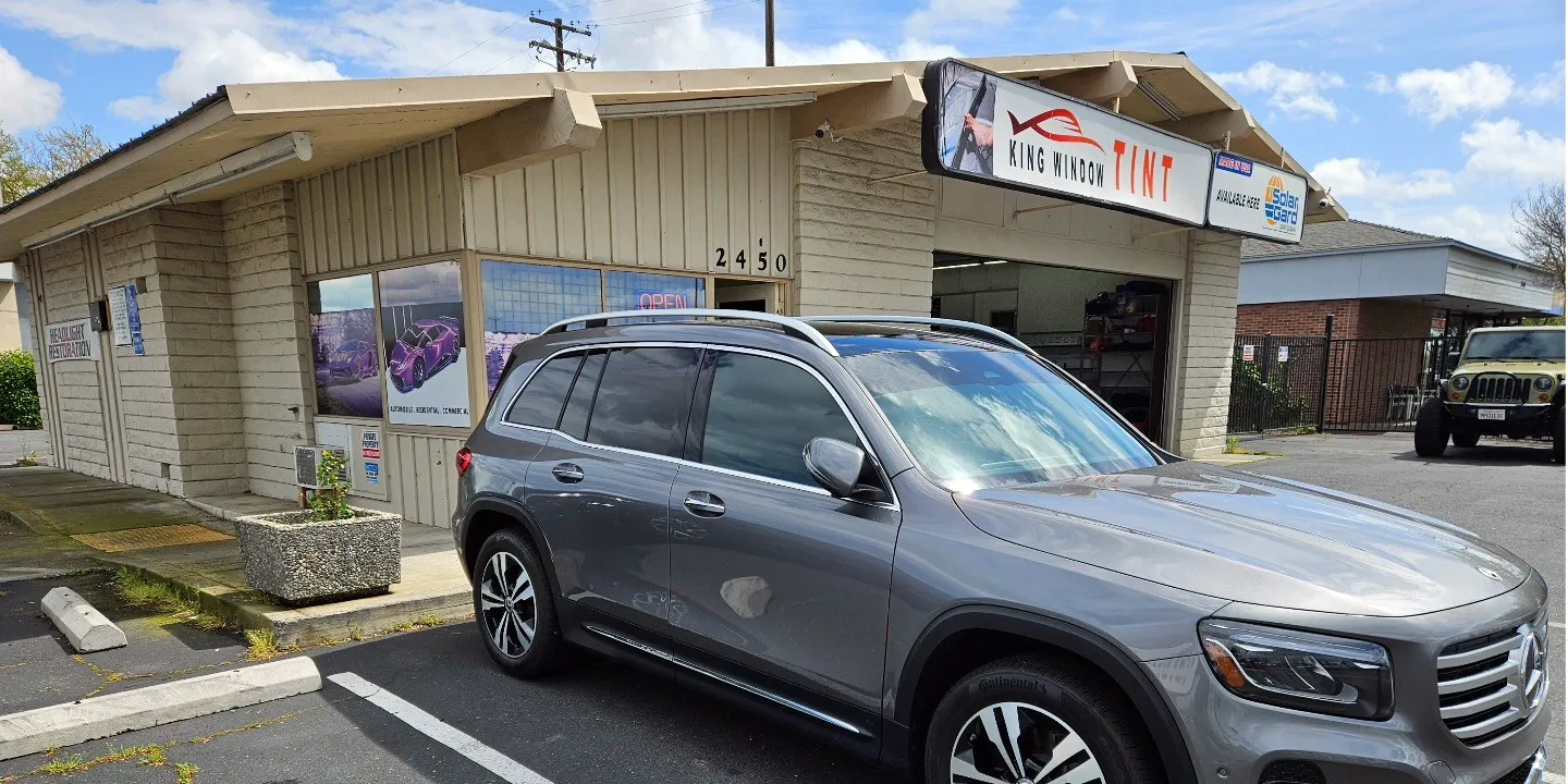 Gray Mercedes-Benz GLB with freshly tinted windows, outside the King Window Tint shop on Fulton Ave in Sacramento