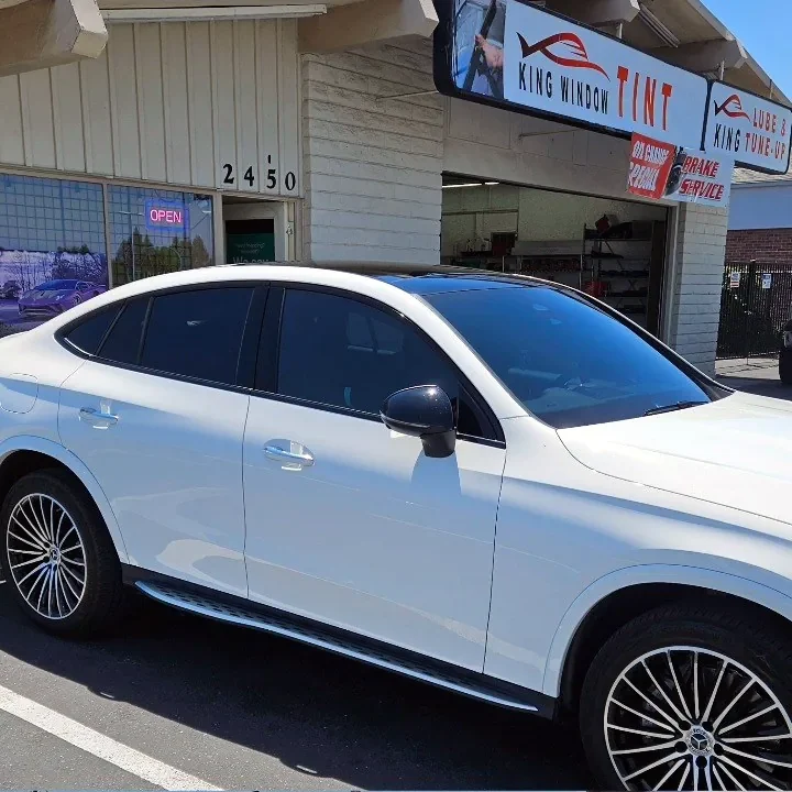 White Mercedes-Benz GLC Coupe with freshly tinted windows, parked in front of King Window Tint at 2450 Fulton Ave, Sacramento