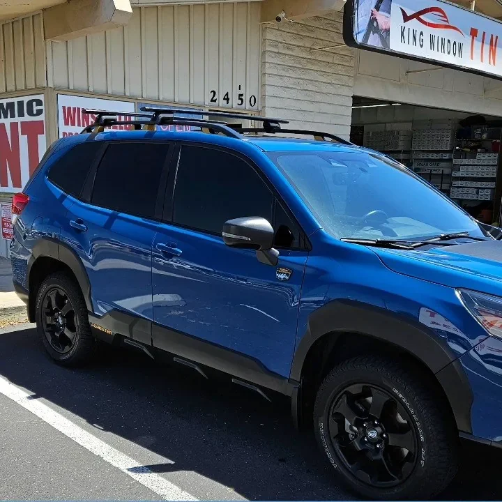 Blue Subaru Forester Wilderness with freshly tinted windows, parked in front of King Window Tint at 2450 Fulton Ave, Sacramento