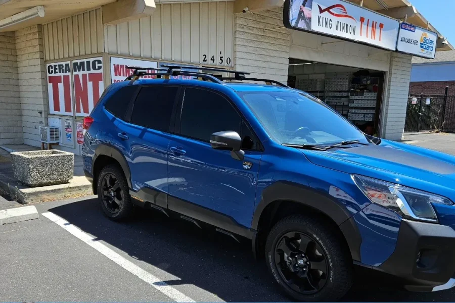 Blue Subaru Forester Wilderness with freshly tinted windows, parked in front of King Window Tint at 2450 Fulton Ave, Sacramento