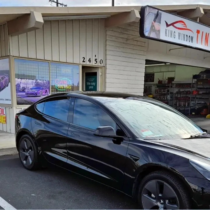 Black Tesla Model 3 with freshly tinted windows, parked in front of King Window Tint at 2450 Fulton Ave, Sacramento
