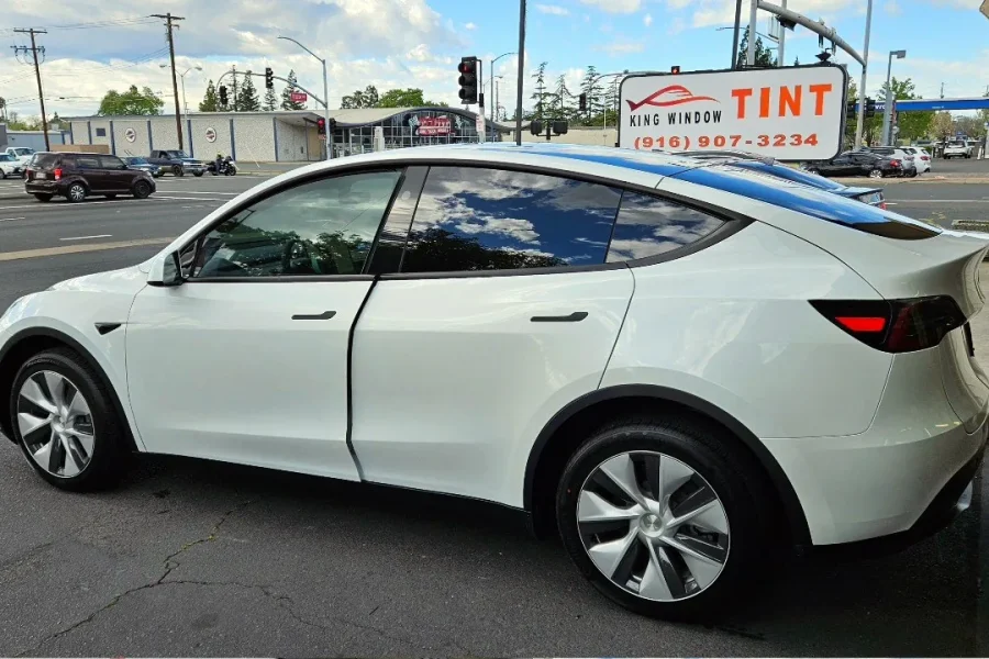 White Tesla Model Y with freshly tinted windows, photographed after its tint job at King Window Tint in Sacramento