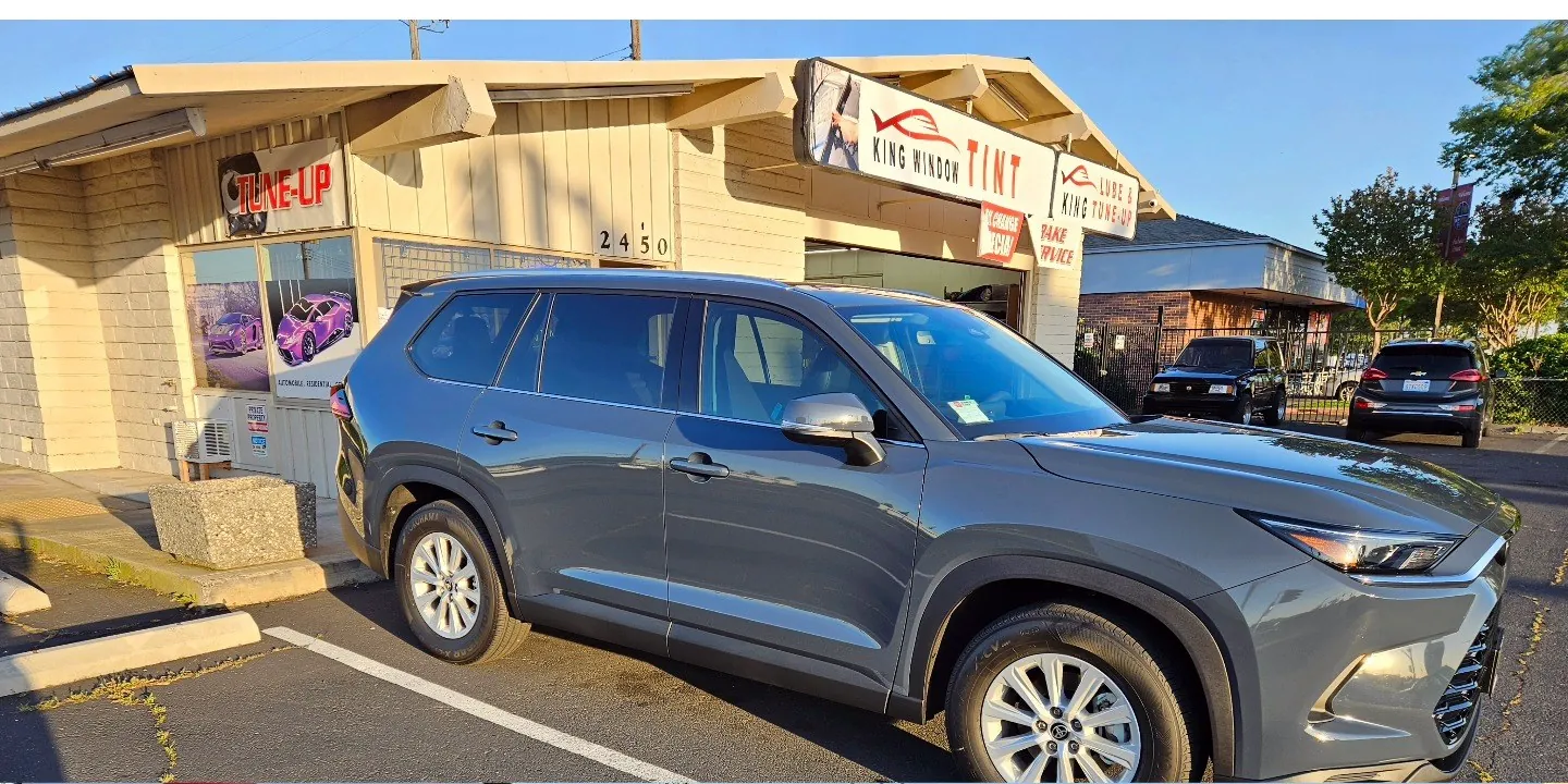 Gray Toyota Grand Highlander with freshly tinted windows, parked in front of King Window Tint at 2450 Fulton Ave, Sacramento
