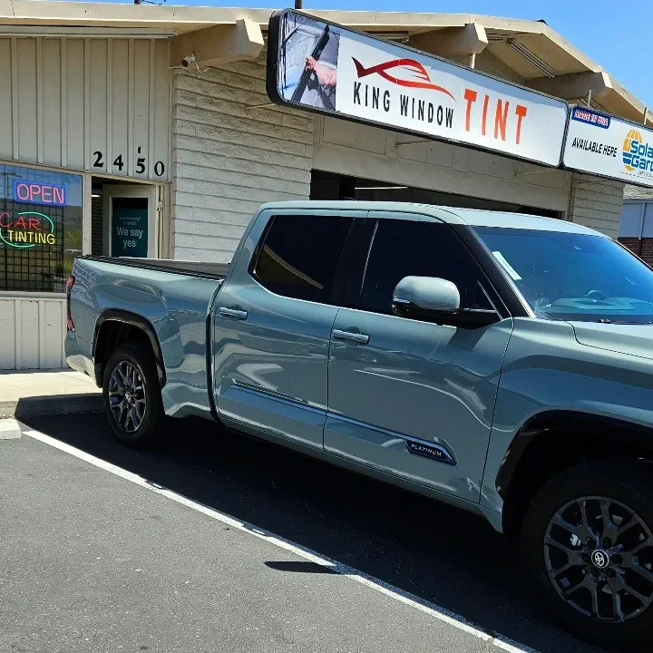 Sage gray Toyota Tundra with freshly tinted windows, outside the King Window Tint shop on Fulton Ave in Sacramento