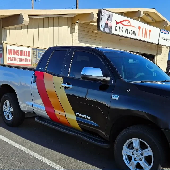 Black and silver Toyota Tundra with freshly tinted windows, in the King Window Tint parking lot on Fulton Avenue, Sacramento (retro stripes)