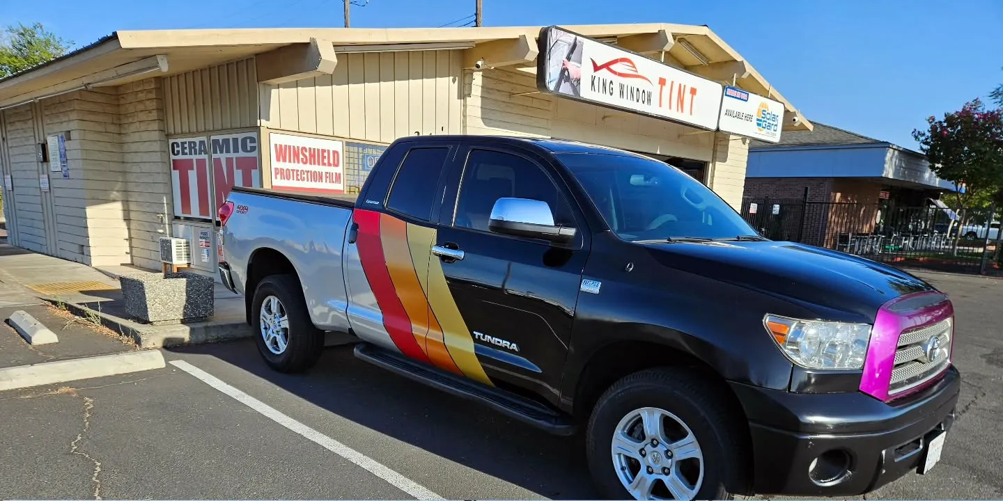 Black and silver Toyota Tundra with freshly tinted windows, in the King Window Tint parking lot on Fulton Avenue, Sacramento (retro stripes)